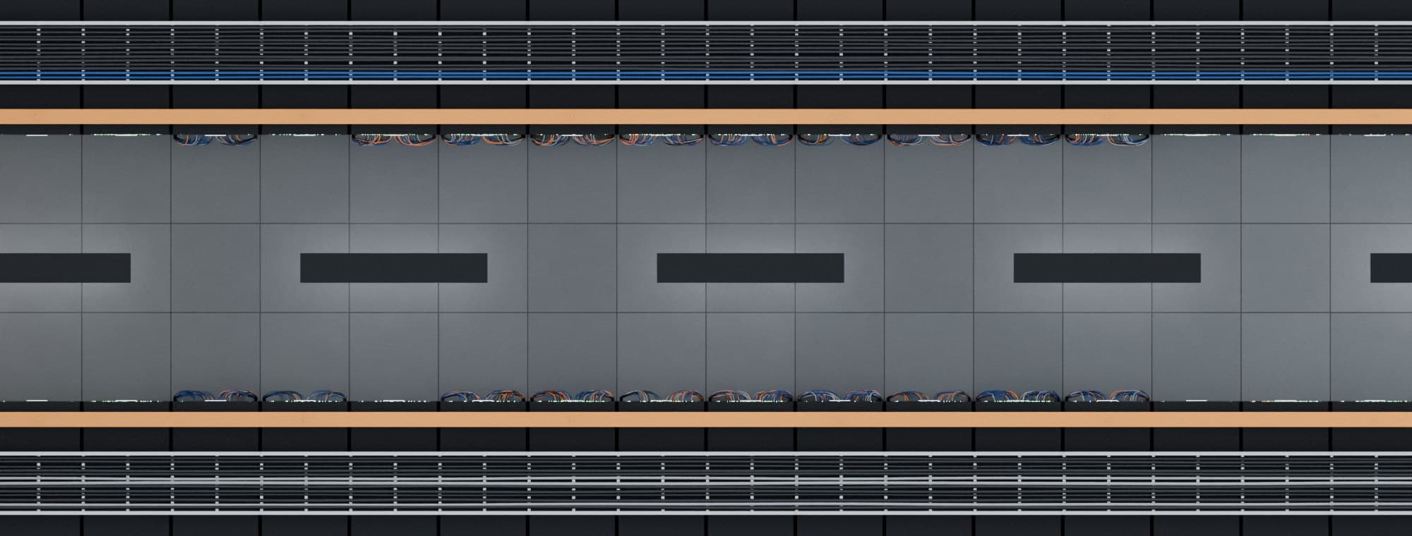 Top-down view of two rack rows either side of an aisle, with cable trays and fibre raceways above