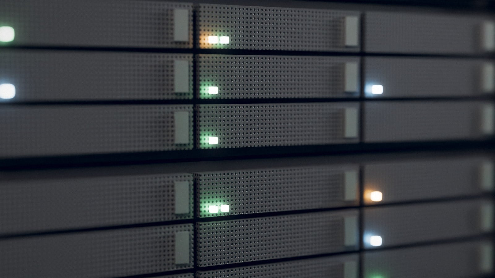 Close view of the drive bays on the front of rack servers, activity lights on